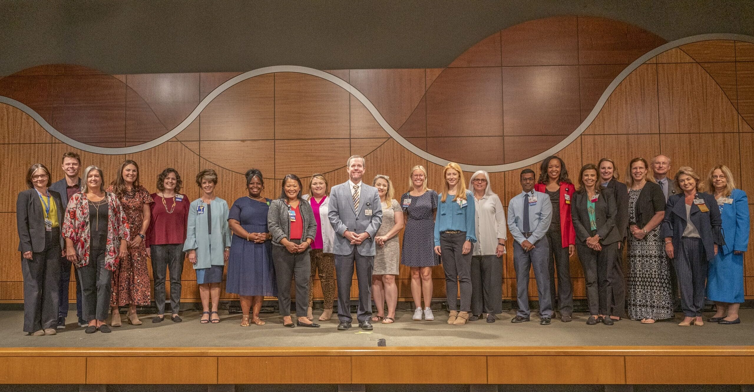 Cam Patterson, M.D., MBA, (front) stands with the 2022 Chancellor’s Circle Grant Awards recipients