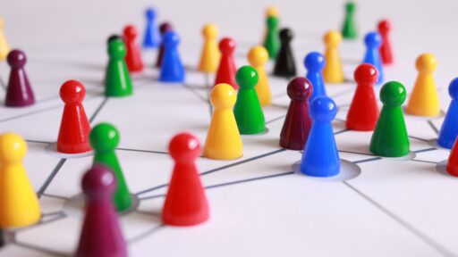 A picture of colorful pawns on a game board