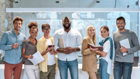 Business Professionals standing together in a casual and friendly manner