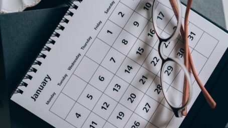 Brown-Framed Eyeglasses on a Calendar