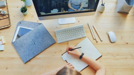 top-view-photo-of-person-writing-on-white-paper