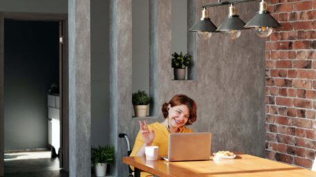 woman in wheelchair working at office table