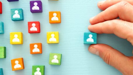 image of colorful blocks with people icons over wooden table ,human resources and management concept.