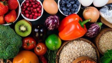 Background healthy food. Fresh fruits, vegetables, fish, berries and cereals. Healthy food, diet and healthy life concept. Top view. Long web format