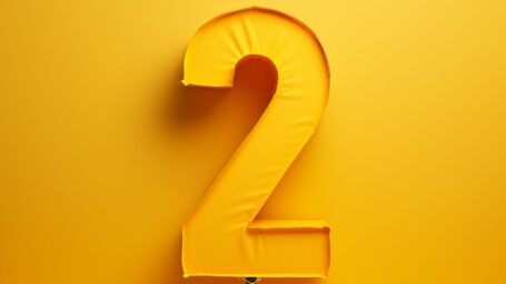 the number two on a yellow background