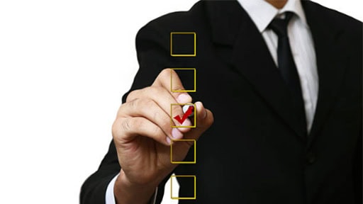 Person using a marker to check off check list boxes