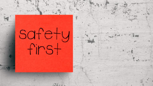 red post it note that says Safety First