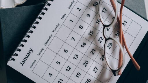 Calendar on a desk with glasses