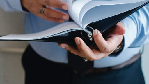 Person holding a binder