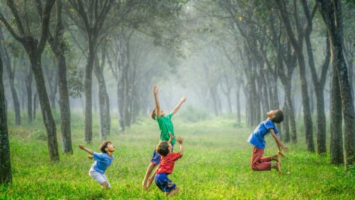 Kids playing soccer outside