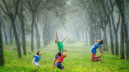 Kids playing soccer outside